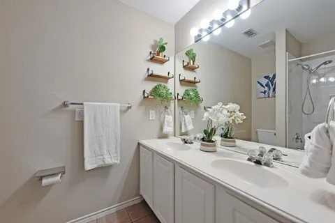 a bathroom with a sink tub and a mirror