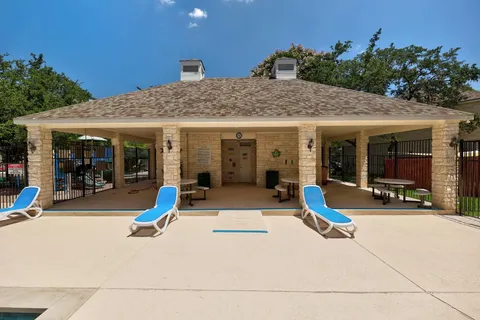 a view of a street with a large tree