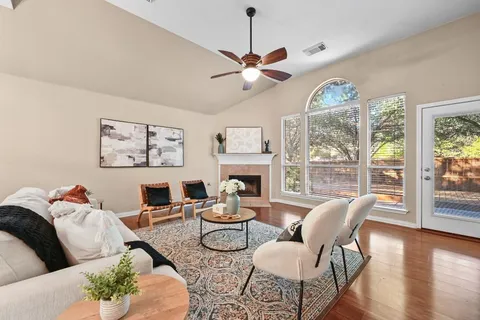 a living room with furniture and a large window
