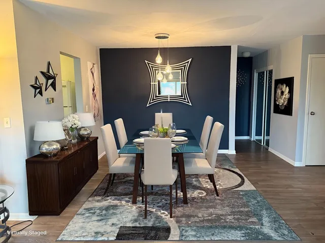 a living room with furniture gym equipment and a wooden floor