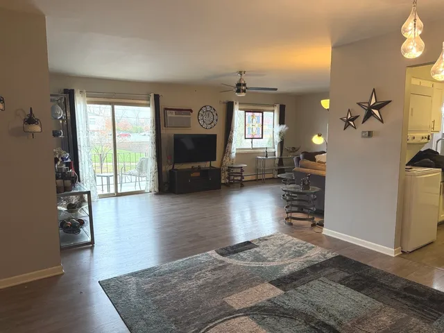 a living room with furniture and a lamp