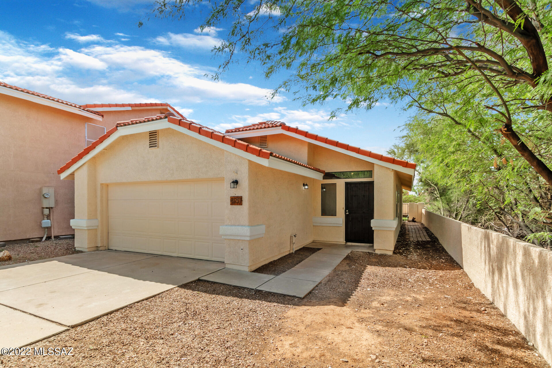 4697 West Weathervane Street Tucson, AZ 85741 - Photo 2 of 25 a view of a house with a yard