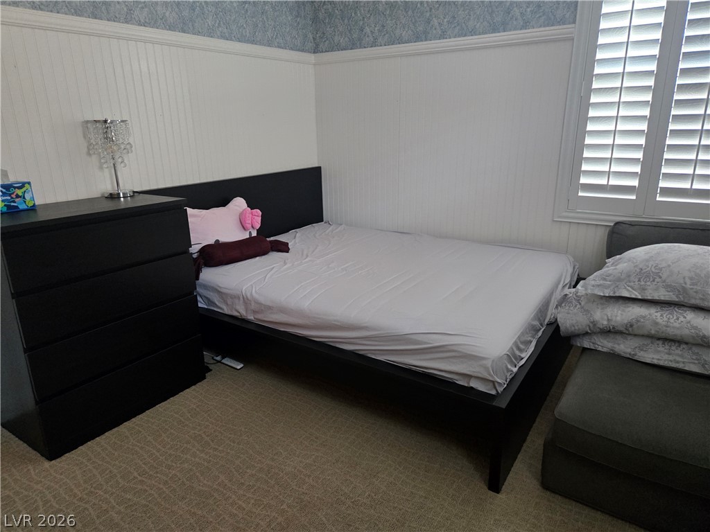 3144 Whitfeild Avenue Henderson, NV 89044 - Photo 52 of 55 Well-lit sleeping quarters with elegant wainscoting and sophisticated window treatments.