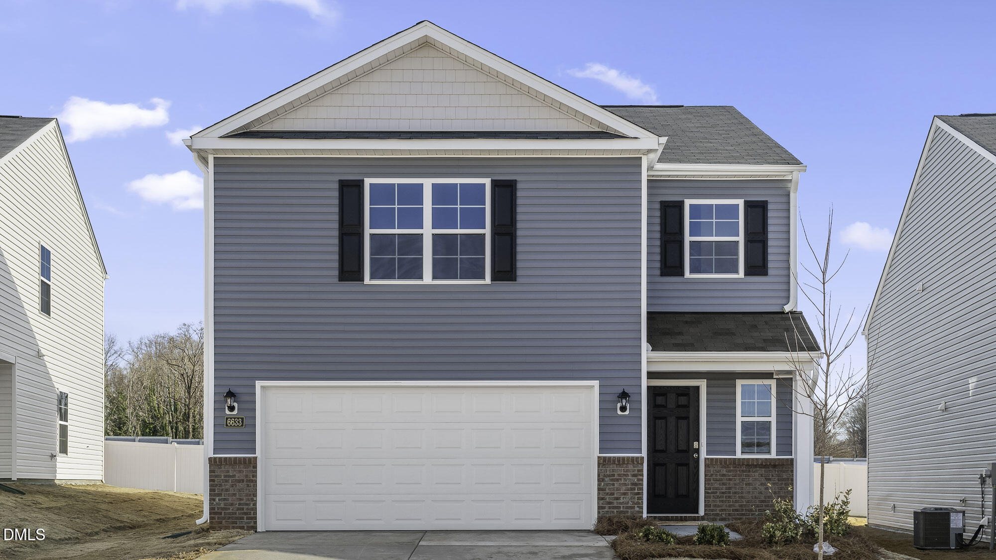 629 Stream Walk Crossing Wendell, NC 27591 - Photo 1 of 38 a front view of a house with a garage