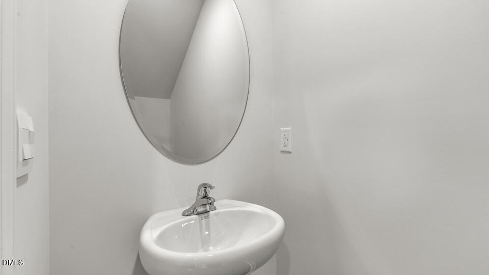 629 Stream Walk Crossing Wendell, NC 27591 - Photo 16 of 38 a bathroom with a sink and a mirror