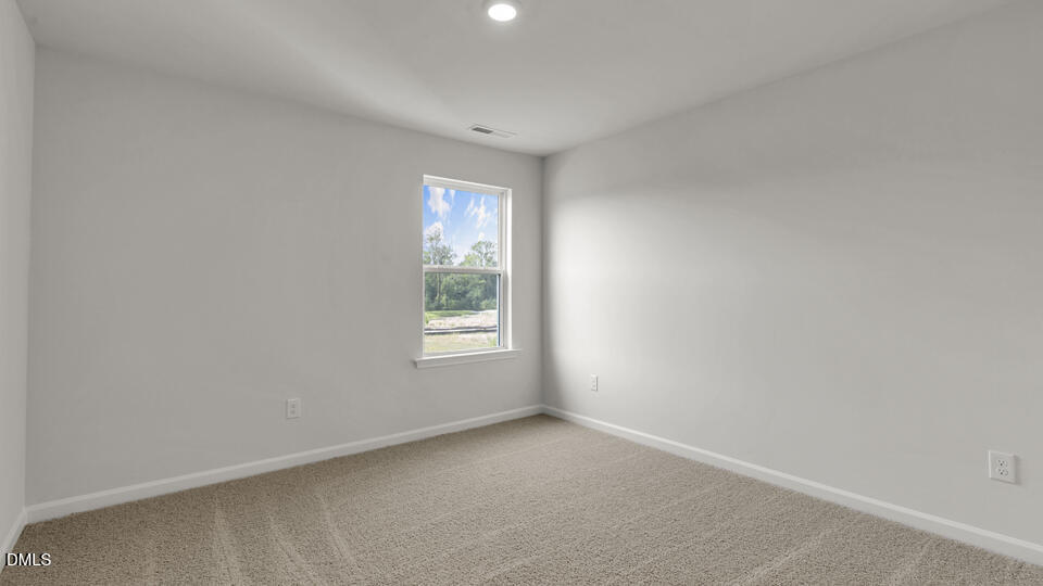 629 Stream Walk Crossing Wendell, NC 27591 - Photo 17 of 38 a view of an empty room with a window