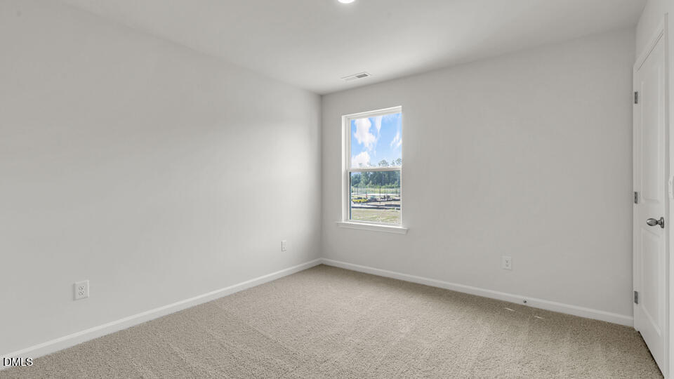 629 Stream Walk Crossing Wendell, NC 27591 - Photo 23 of 38 an empty room with windows