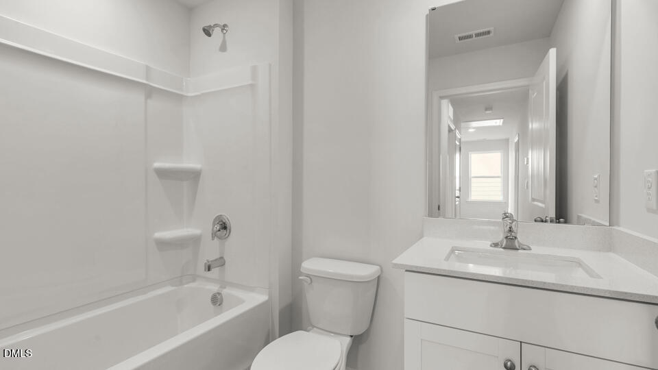 629 Stream Walk Crossing Wendell, NC 27591 - Photo 26 of 38 a bathroom with a sink toilet vanity and shower