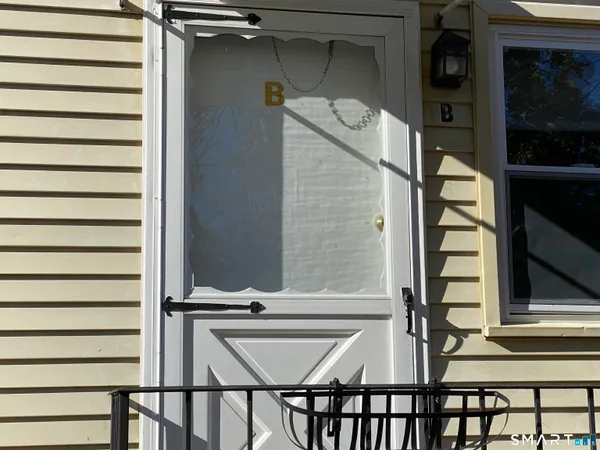 a view of entryway with a front door