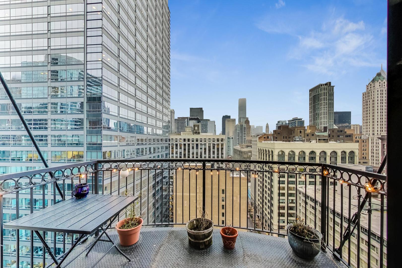 8 West Monroe Street, Unit 2008 Chicago, IL 60603 - Photo 14 of 18 a view of roof deck with two chairs and potted plants