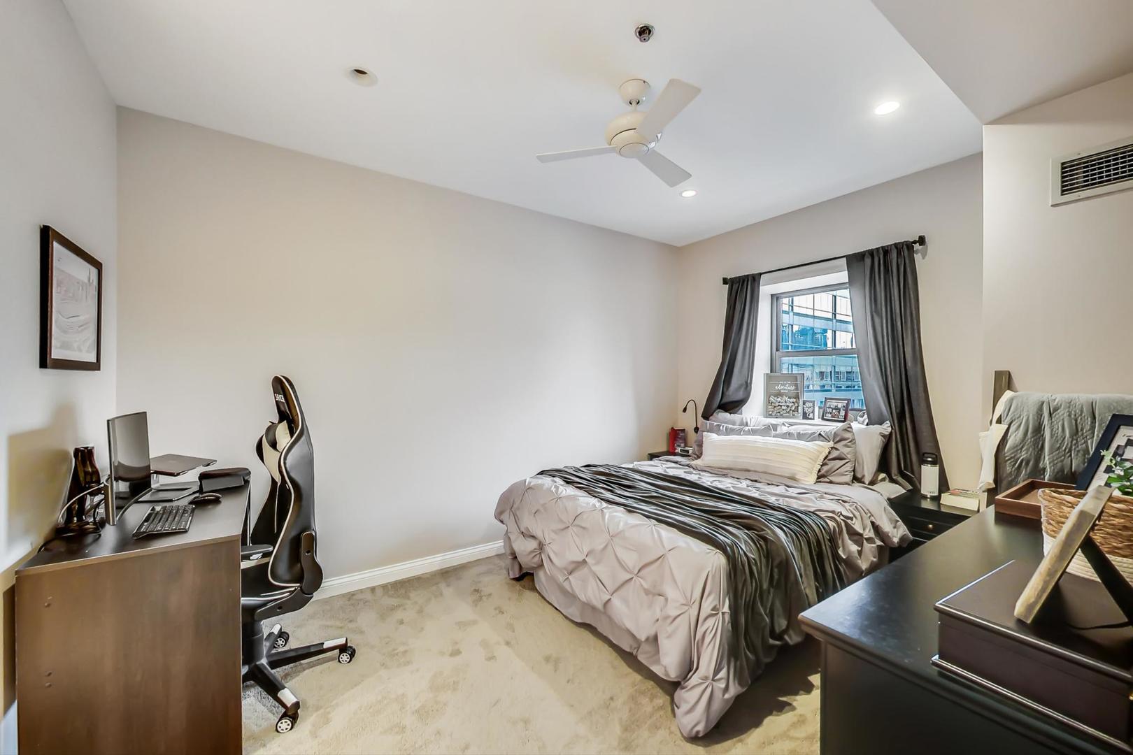 8 West Monroe Street, Unit 2008 Chicago, IL 60603 - Photo 7 of 18 a bedroom with double bed and a window