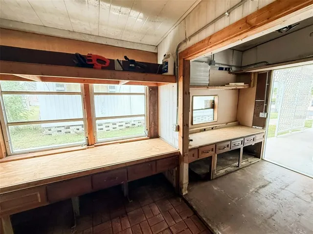 a bedroom with furniture and a window