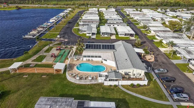 an aerial view of a house with a swimming pool