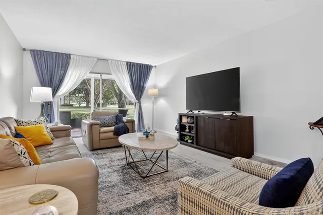 a living room with furniture and a table