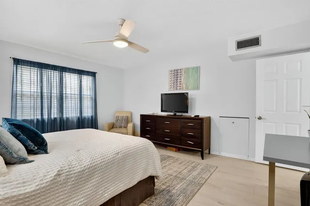 a view of a house with a yard and plants