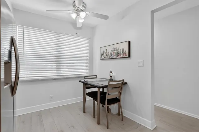 a kitchen with stainless steel appliances a stove microwave and sink