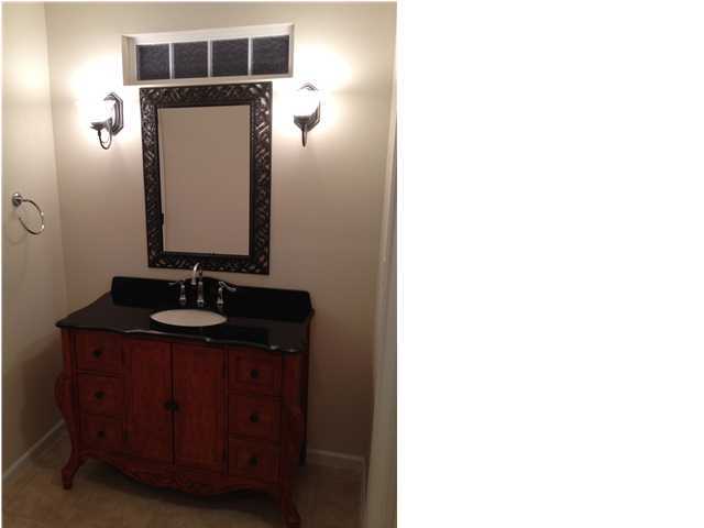 5200 Moore Loop Crestview, FL 32536 - Photo 17 of 29 a bathroom with a sink and a mirror