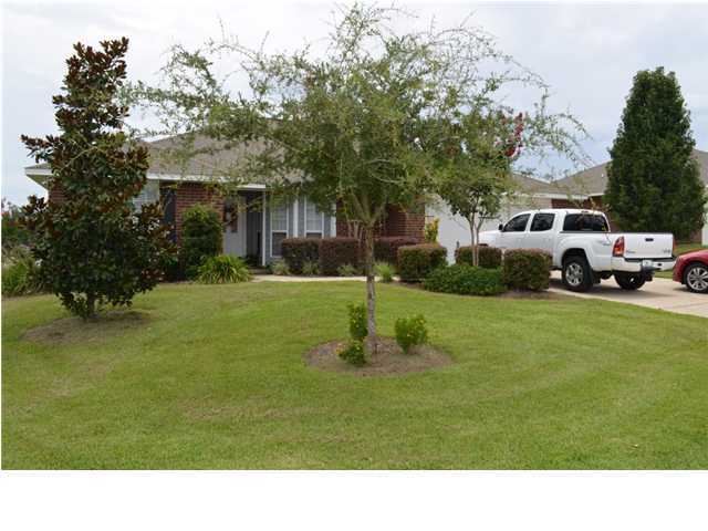 5200 Moore Loop Crestview, FL 32536 - Photo 3 of 29 a house view with a garden space