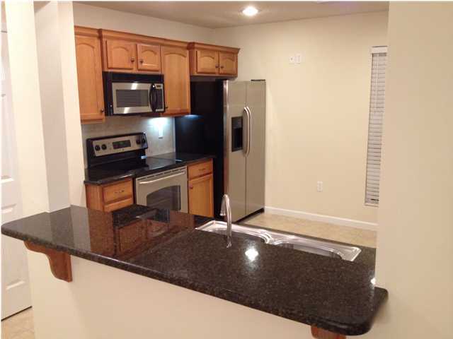 5200 Moore Loop Crestview, FL 32536 - Photo 6 of 29 a kitchen with stainless steel appliances a refrigerator and stove