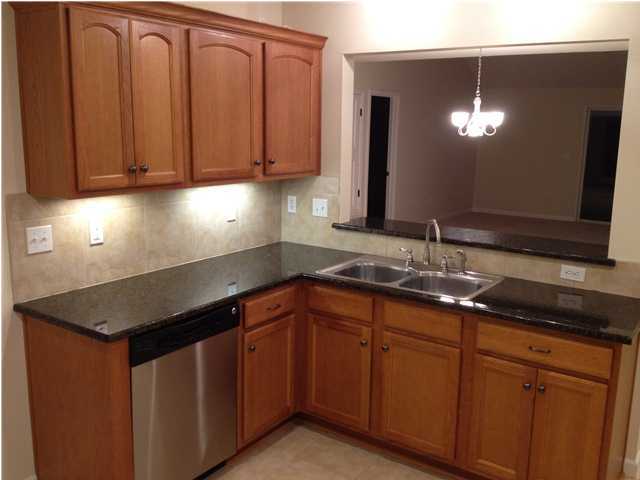 5200 Moore Loop Crestview, FL 32536 - Photo 8 of 29 a kitchen with stainless steel appliances granite countertop cabinets and sink