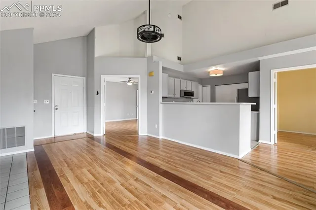 a view of kitchen with furniture and wooden floor