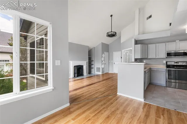 a kitchen with a sink cabinets and stainless steel appliances