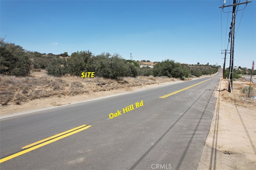 5 Oak Hill Road Oak Hills, CA 92344 - Photo 17 of 21 a view of a street with a yard