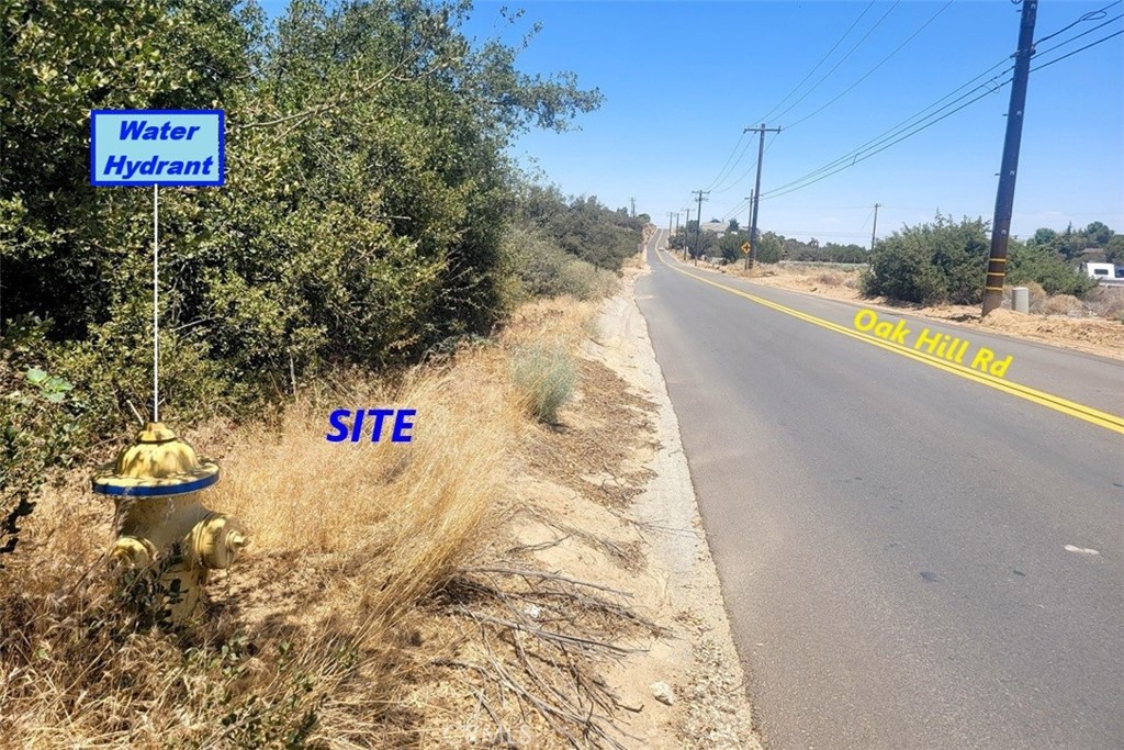 5 Oak Hill Road Oak Hills, CA 92344 - Photo 19 of 21 a view of a street with houses on both side of it
