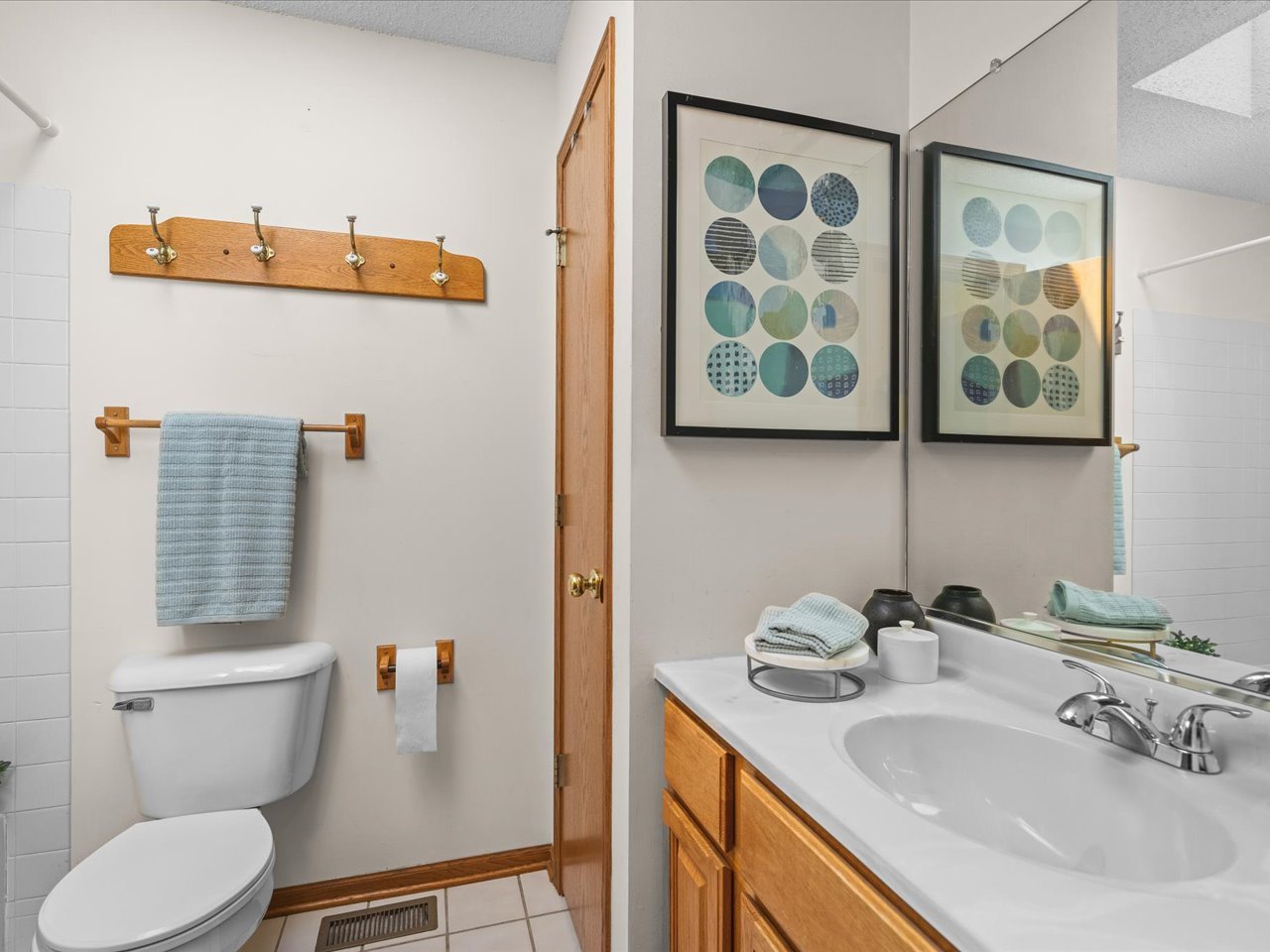 1646 Larchmont Road Davis, IL 61019 - Photo 36 of 50 a bathroom with a toilet sink and mirror