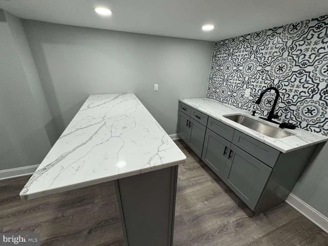 a kitchen with a sink and a stove