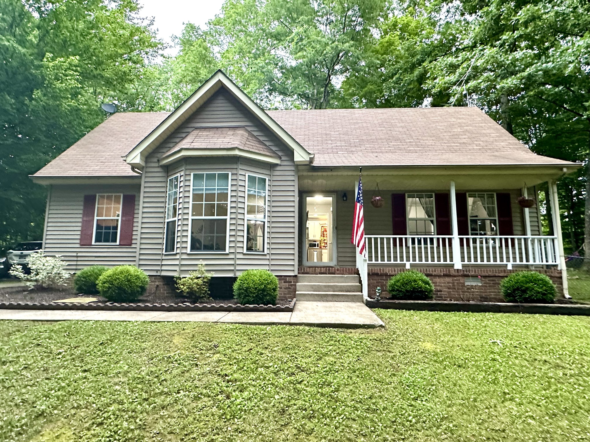 a front view of a house with garden