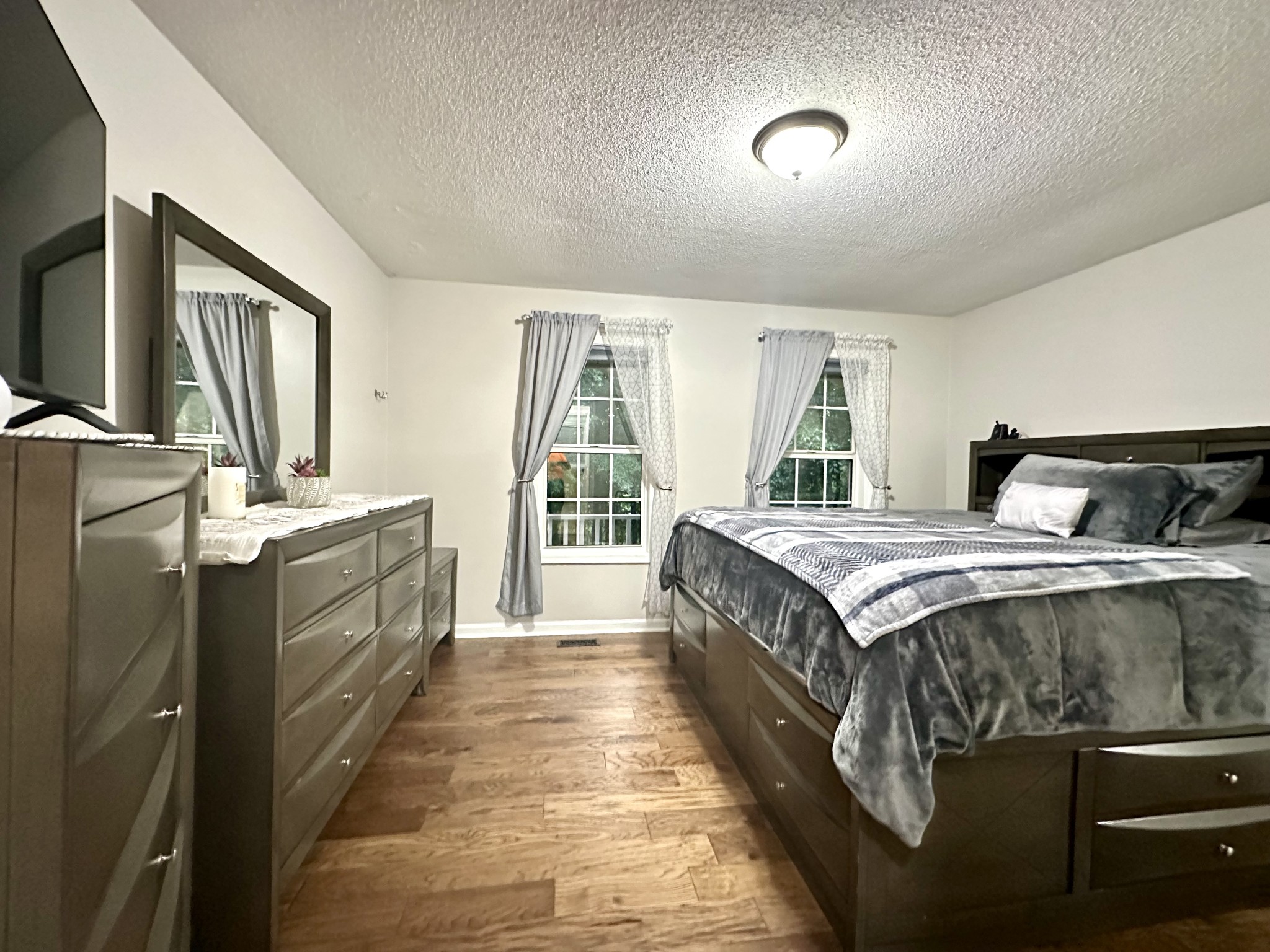 2417 Patterson Road Woodlawn, TN 37191 - Photo 33 of 68 a spacious bedroom with a bed and a large window