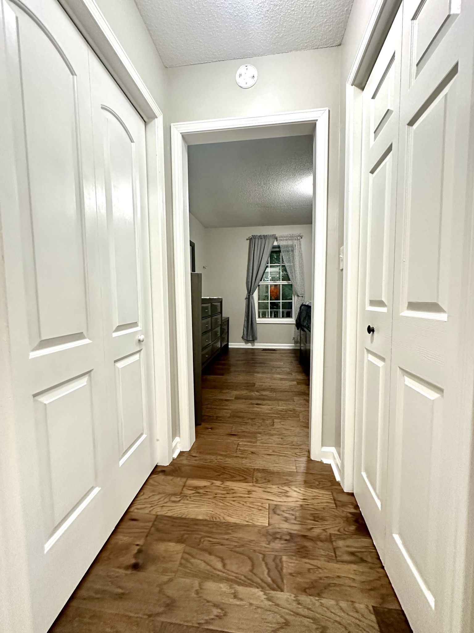 2417 Patterson Road Woodlawn, TN 37191 - Photo 39 of 68 a view of a hallway with wooden floor and closet area