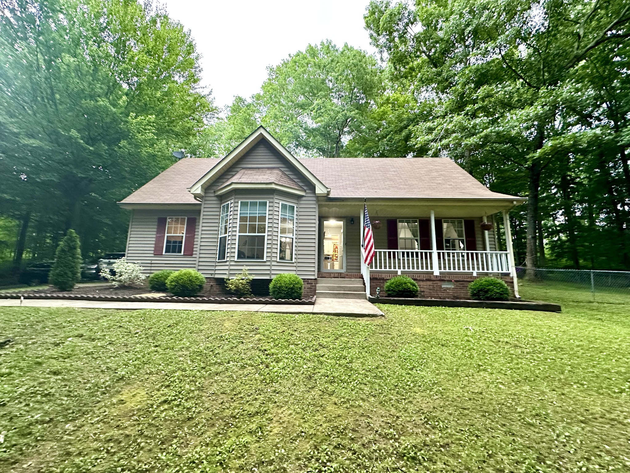 2417 Patterson Road Woodlawn, TN 37191 - Photo 4 of 68 a front view of a house with a yard