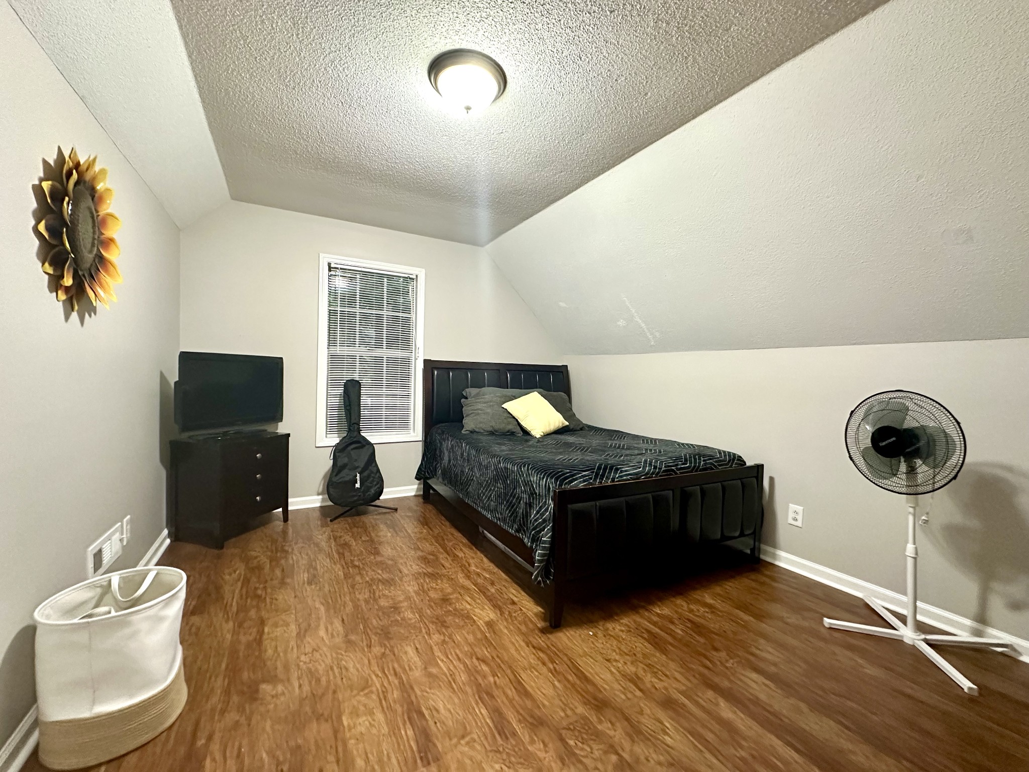 2417 Patterson Road Woodlawn, TN 37191 - Photo 49 of 68 a bedroom with a bed and a flat screen tv
