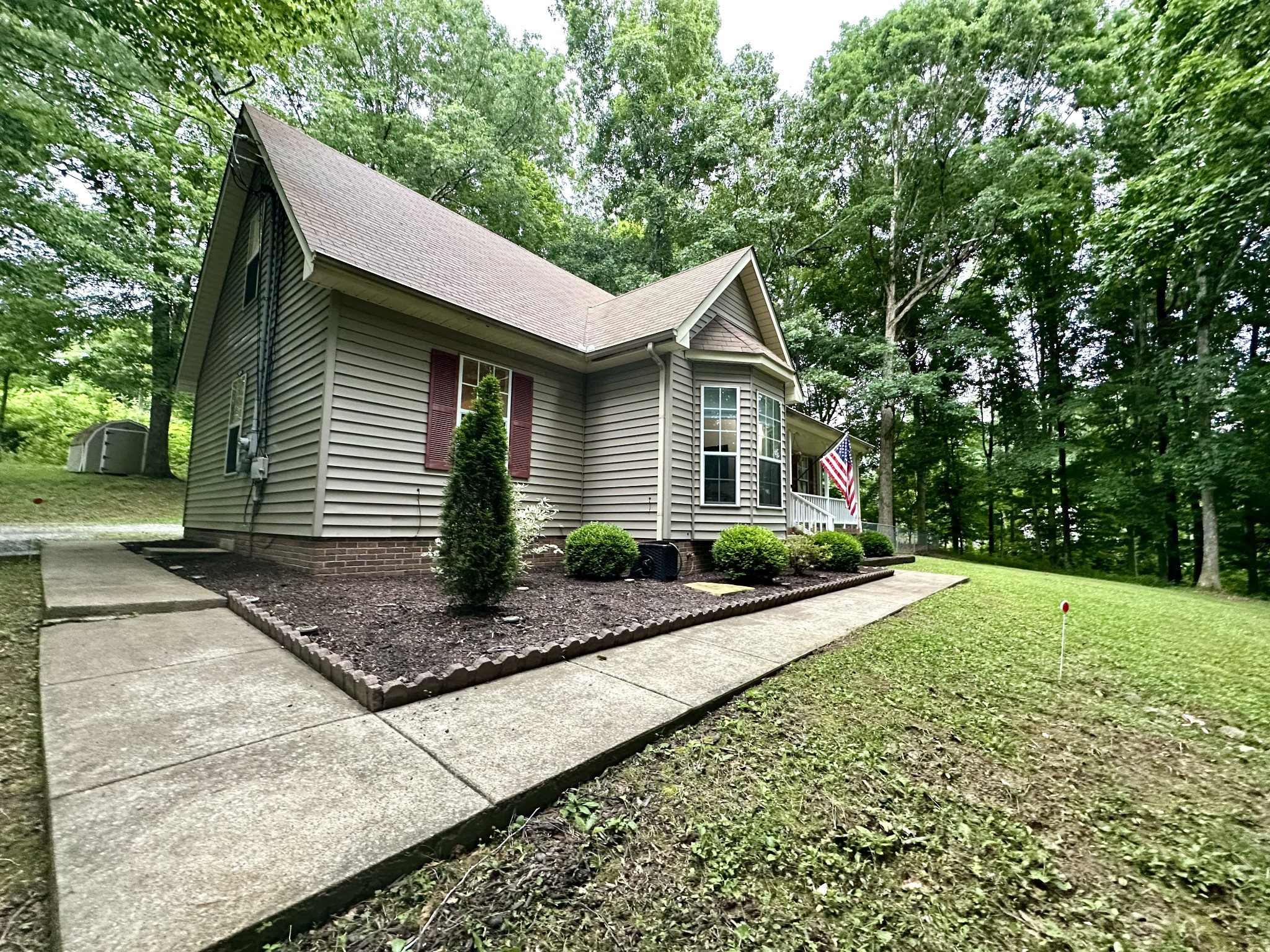 2417 Patterson Road Woodlawn, TN 37191 - Photo 6 of 68 a front view of a house with yard