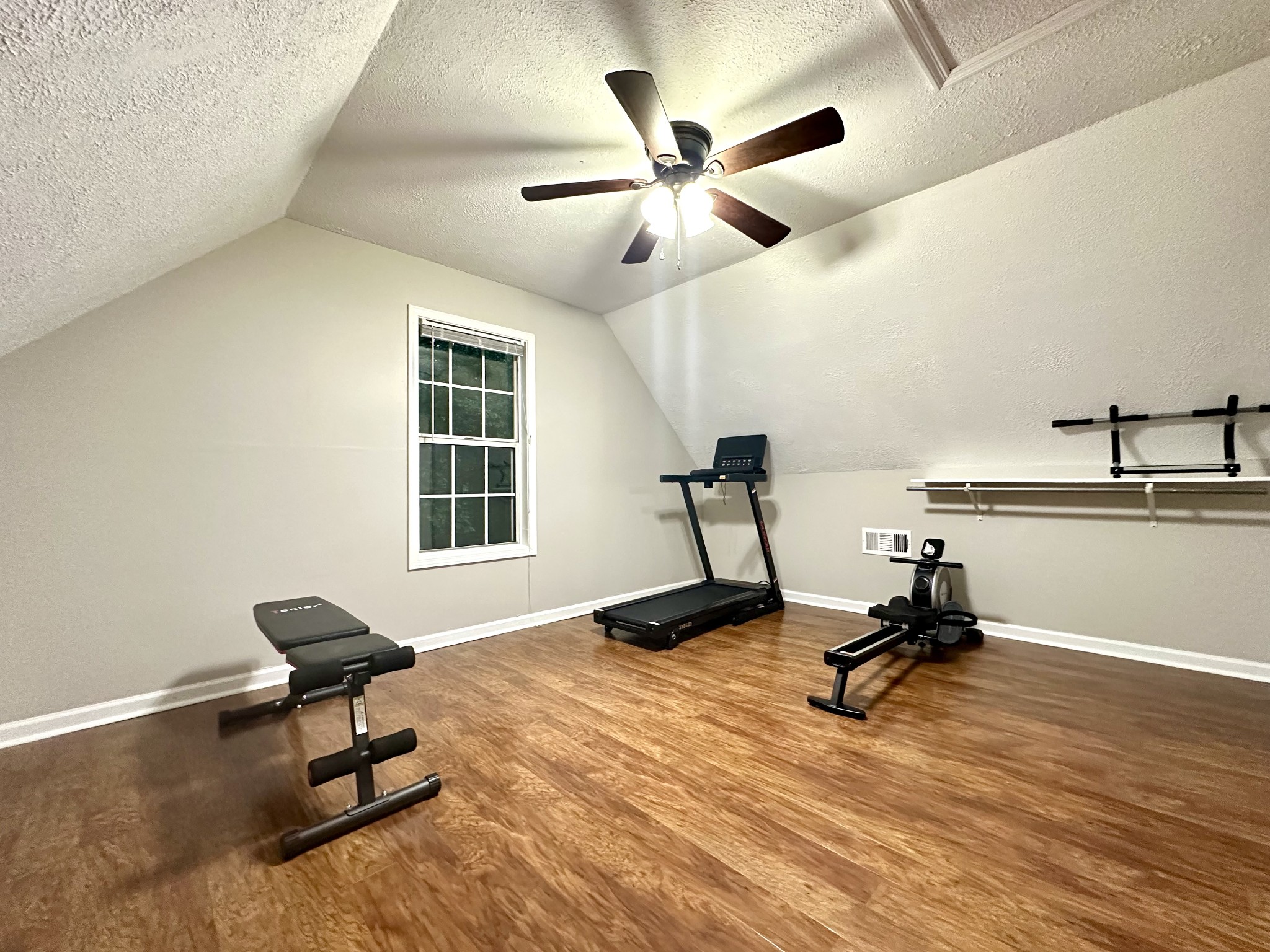 2417 Patterson Road Woodlawn, TN 37191 - Photo 67 of 68 a living room with a window and a ceiling fan