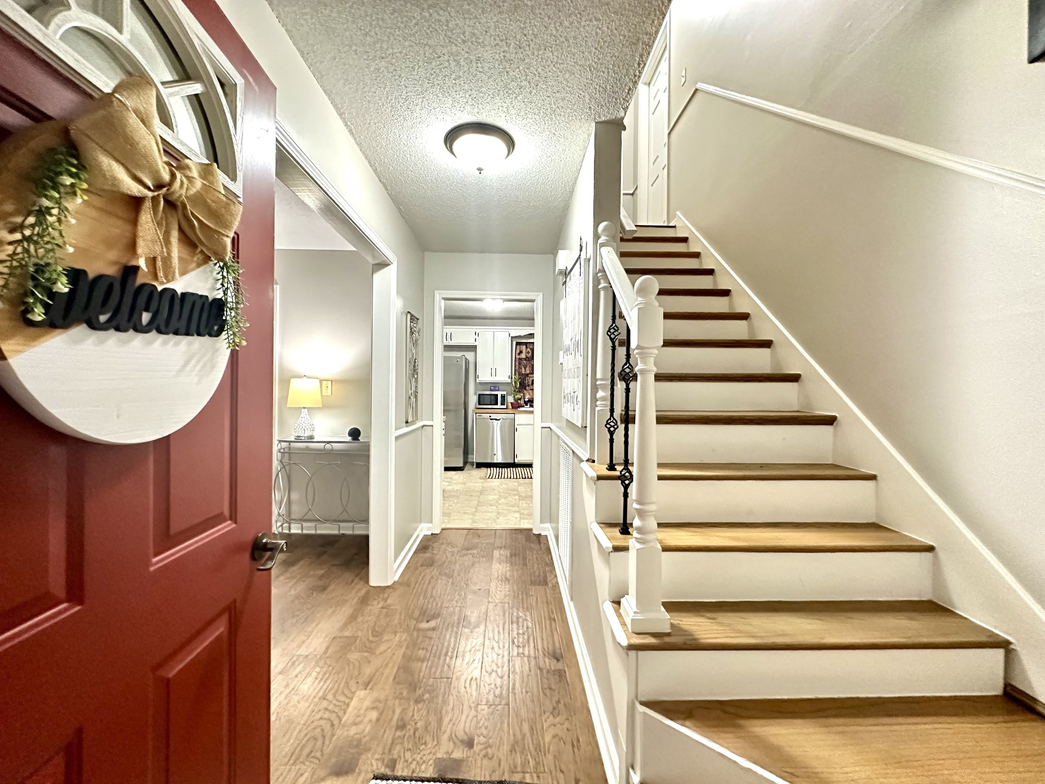 2417 Patterson Road Woodlawn, TN 37191 - Photo 10 of 68 a view of a hallway with wooden floor and staircase