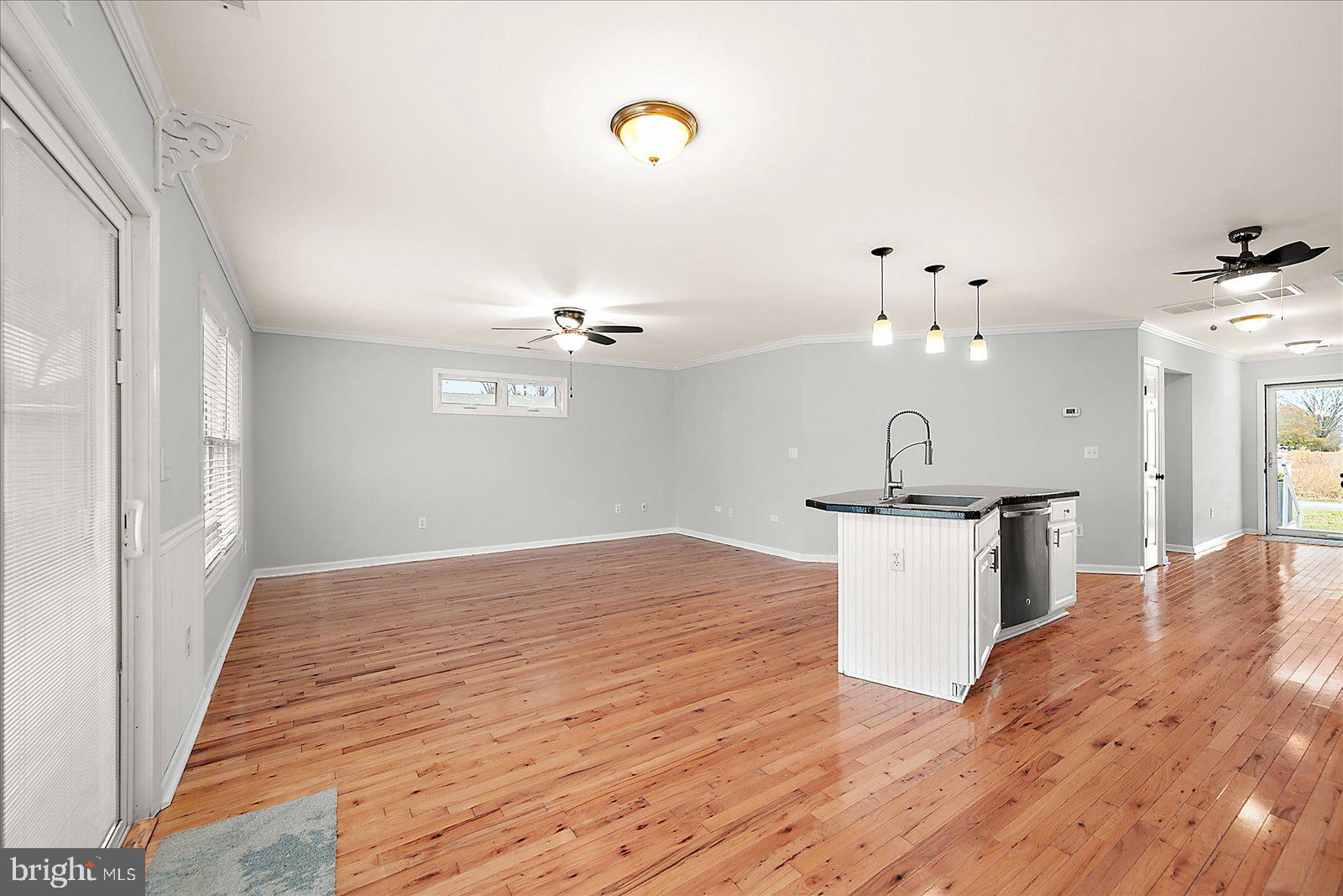 36405 Poplar Neck Road Willards, MD 21874 - Photo 10 of 50 a view of kitchen and hall with wooden floor