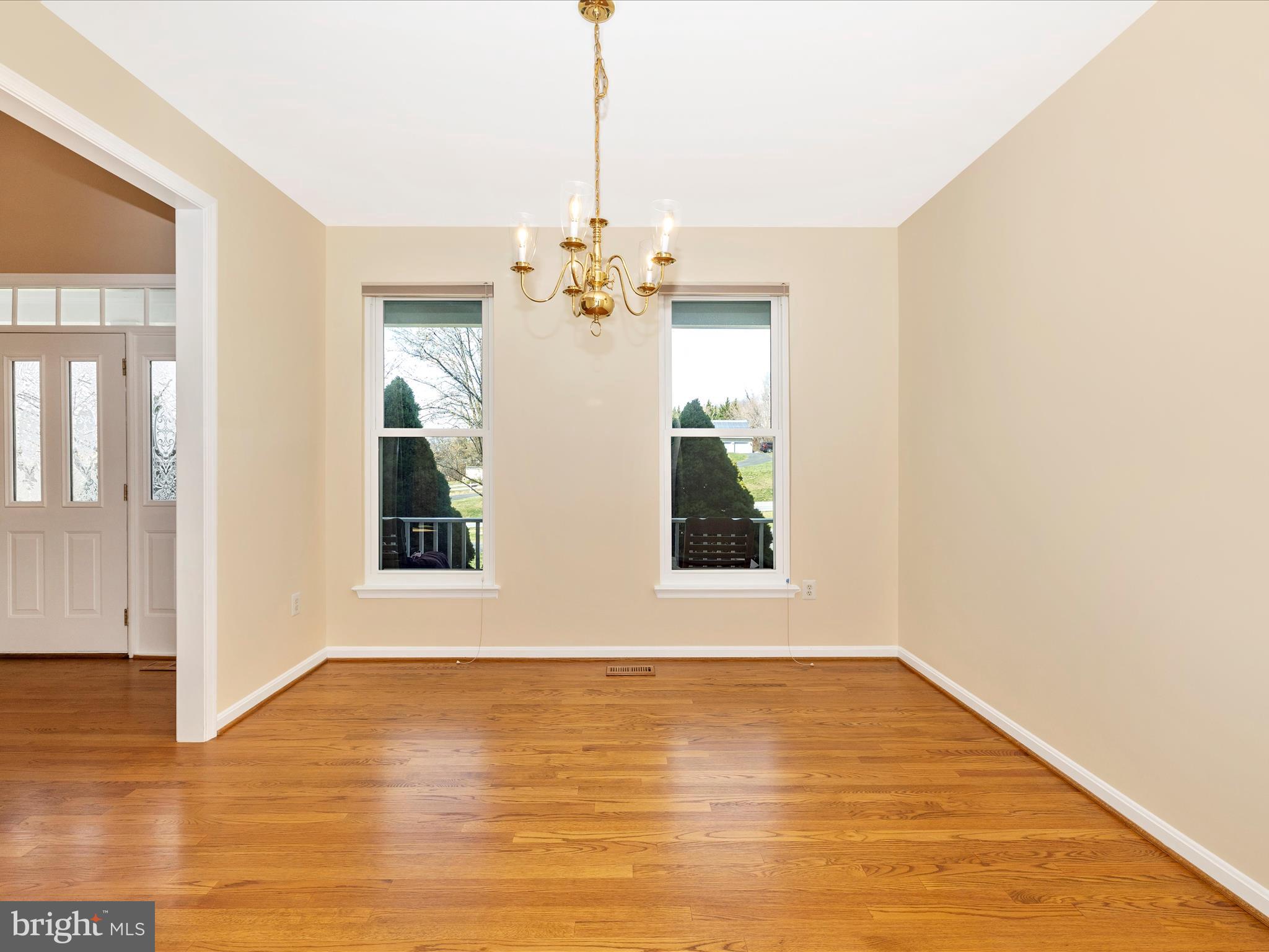 3831 Roundtree Road Jefferson, MD 21755 - Photo 11 of 34 a view of an empty room with wooden floor and a window