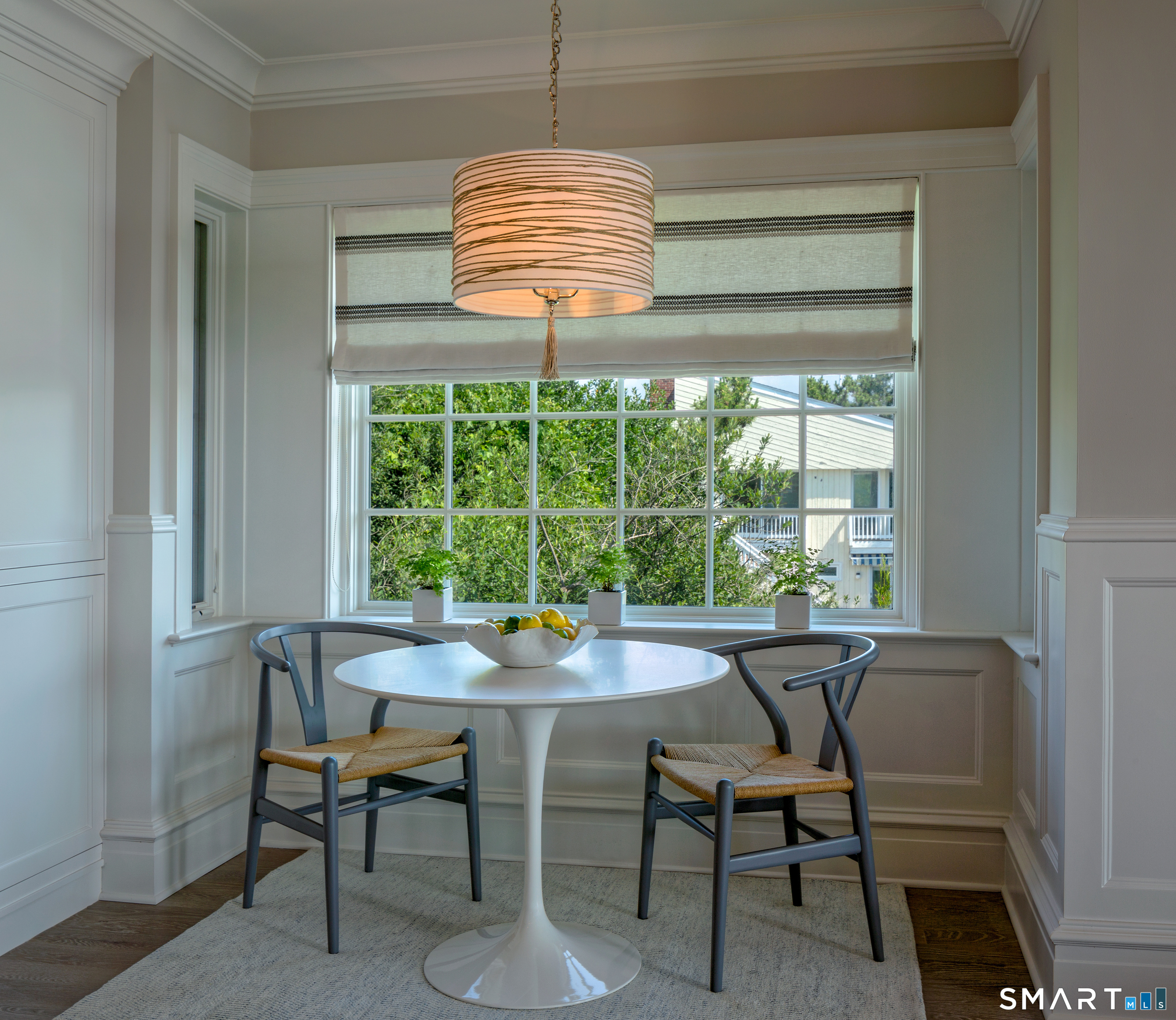 7 Sandpiper Road Westport, CT 06880 - Photo 12 of 34 a dining room with furniture a chandelier and a rug