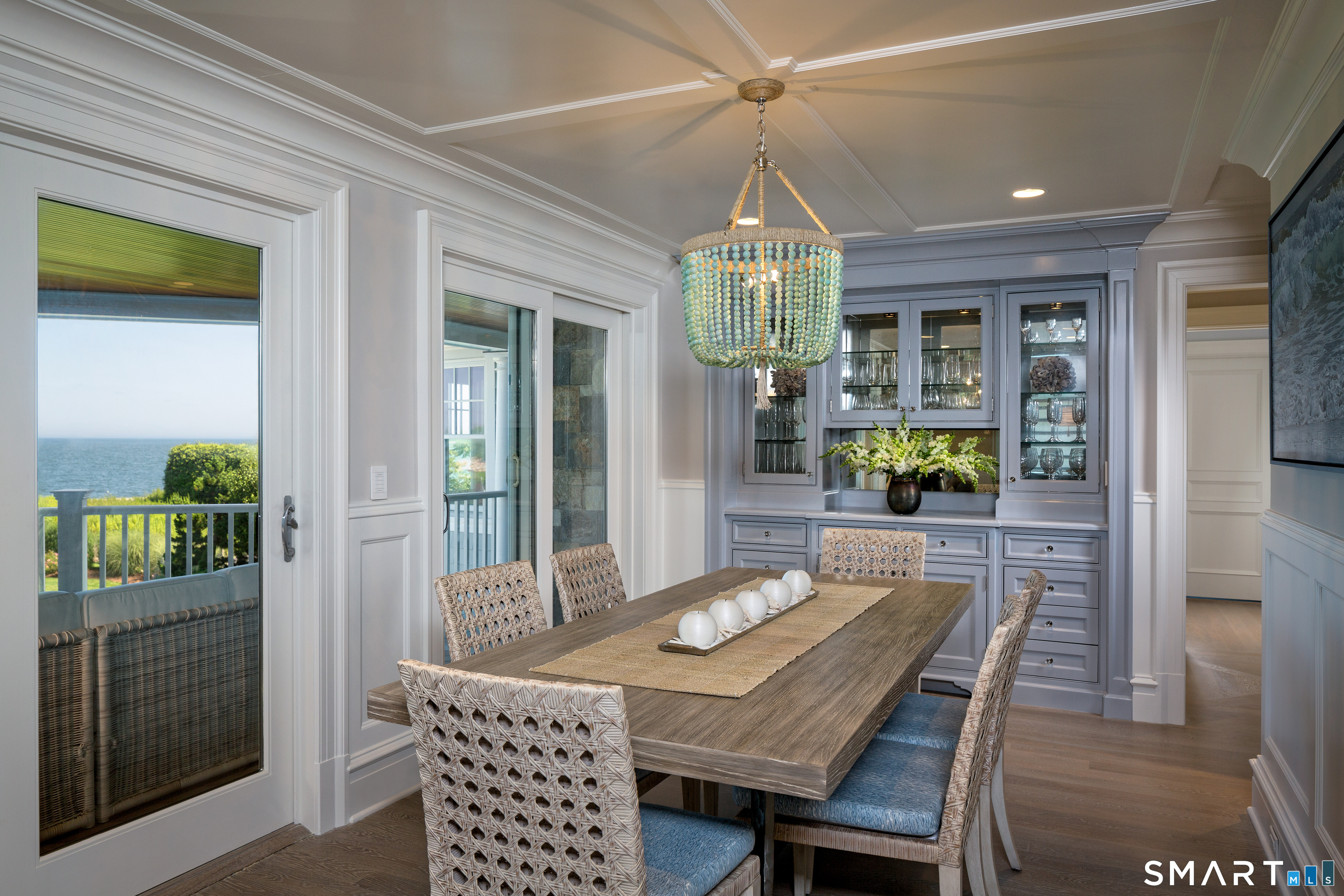 7 Sandpiper Road Westport, CT 06880 - Photo 13 of 34 a dining room with furniture a chandelier and wooden floor