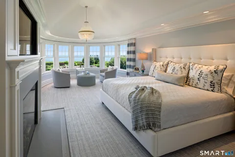 a bedroom with bed or furniture and a fireplace