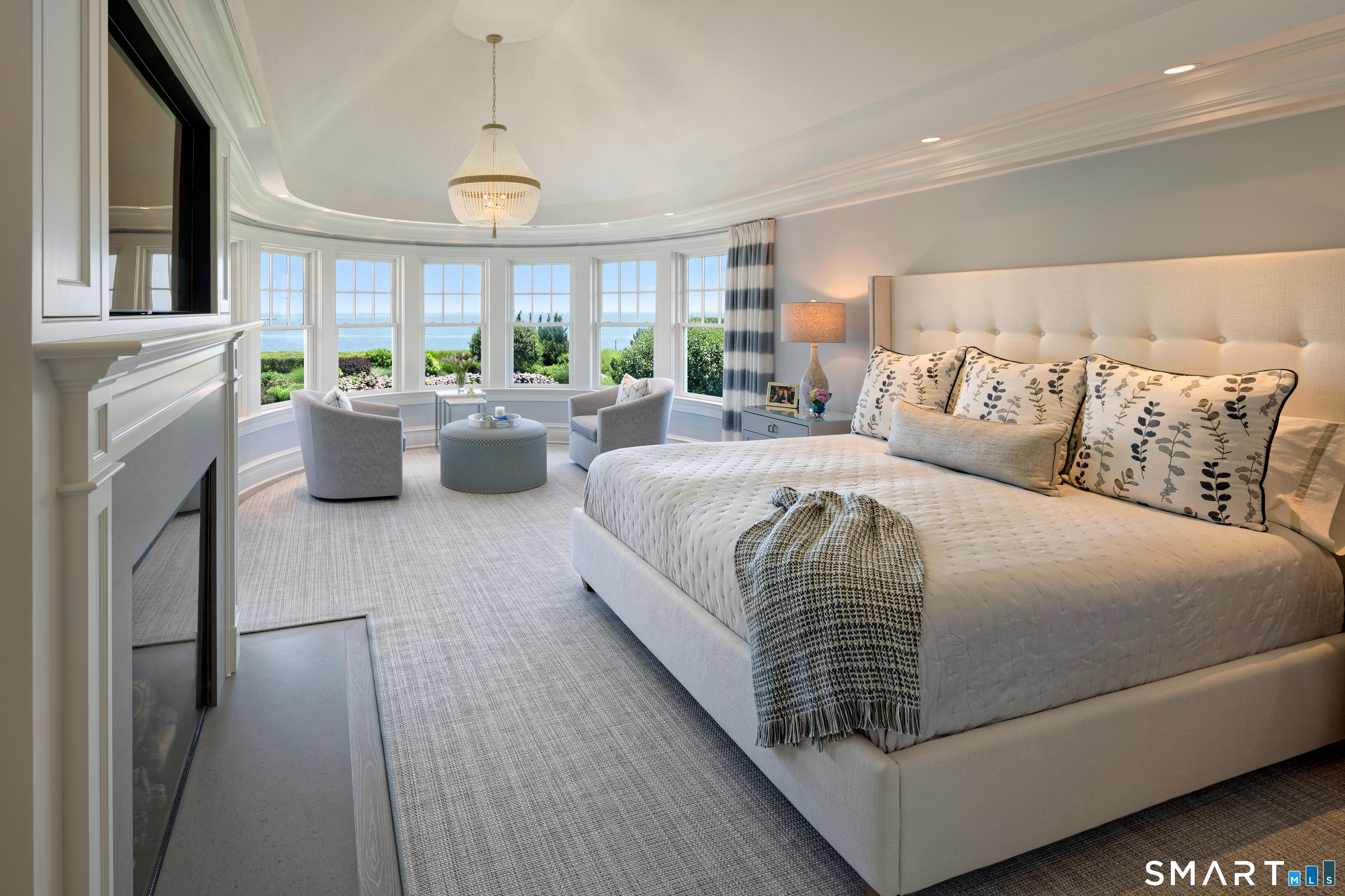 7 Sandpiper Road Westport, CT 06880 - Photo 16 of 34 a bedroom with bed or furniture and a fireplace