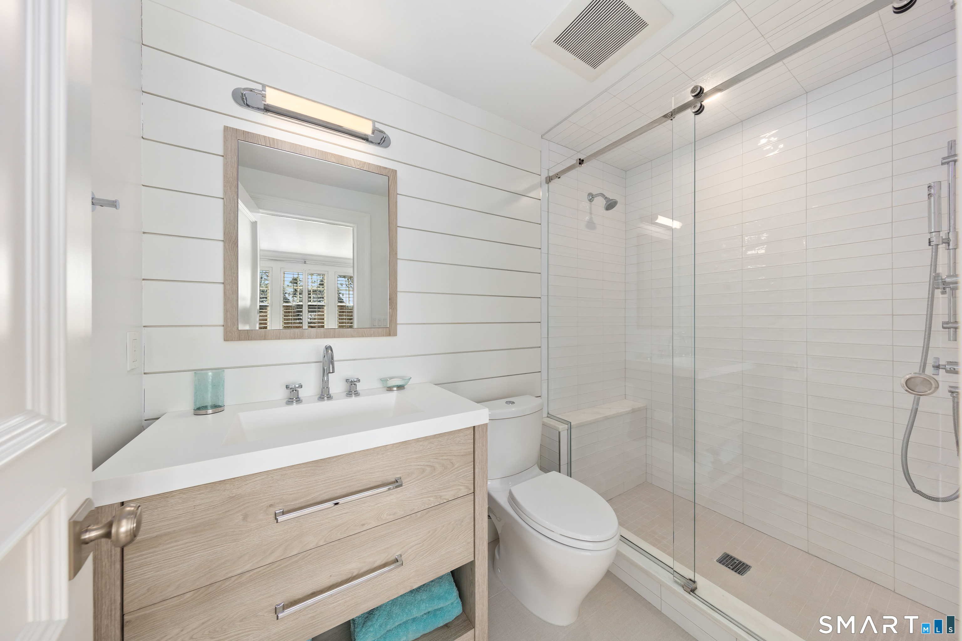 7 Sandpiper Road Westport, CT 06880 - Photo 21 of 34 a bathroom with a double vanity sink toilet and shower