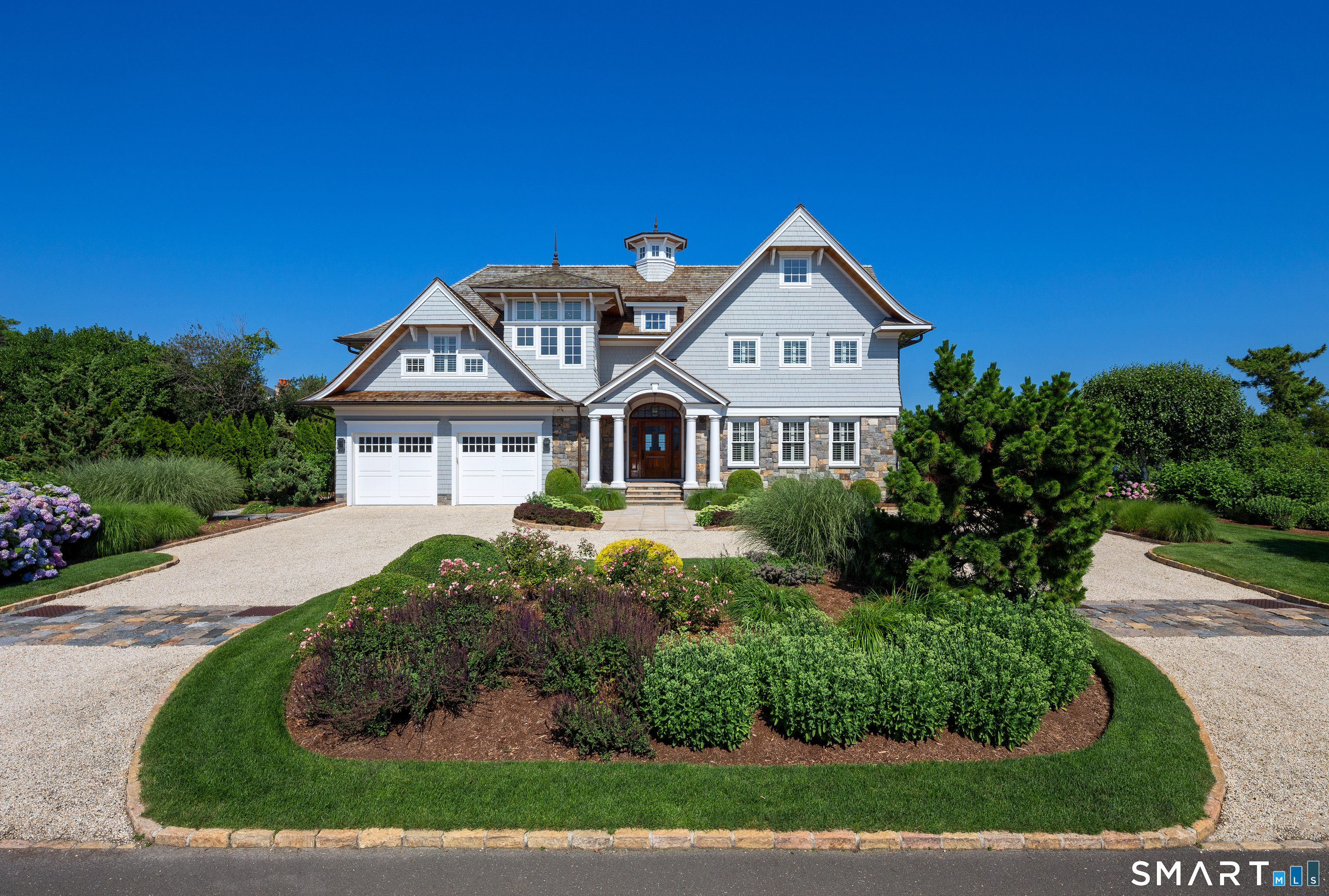 7 Sandpiper Road Westport, CT 06880 - Photo 4 of 34 a front view of a house with a yard