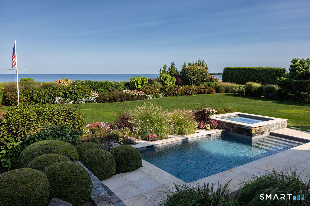 7 Sandpiper Road Westport, CT 06880 - Photo 5 of 34 a view of a garden with couches and lounge chairs