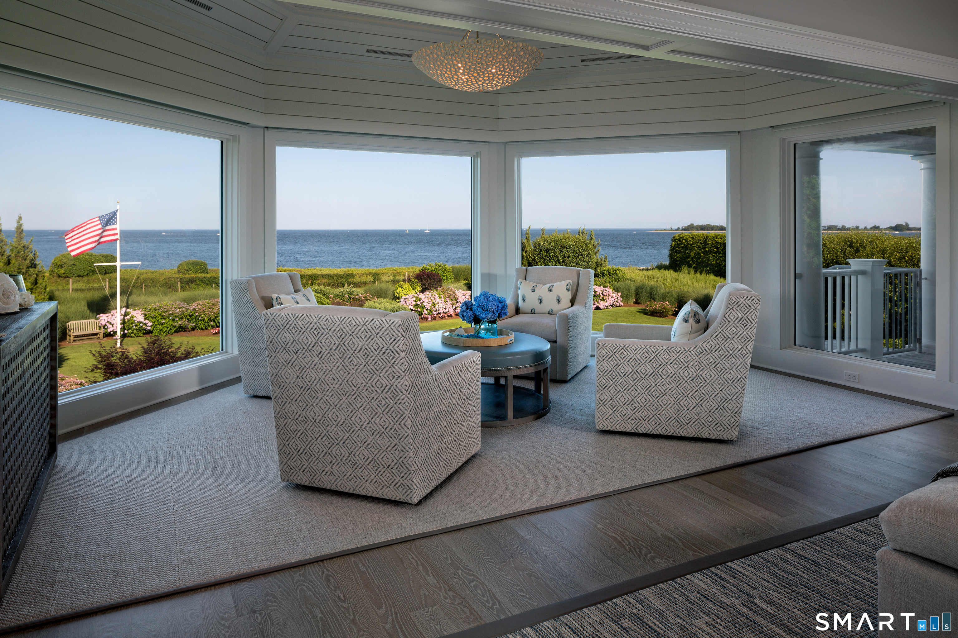 7 Sandpiper Road Westport, CT 06880 - Photo 6 of 34 a living room with furniture and a floor to ceiling window