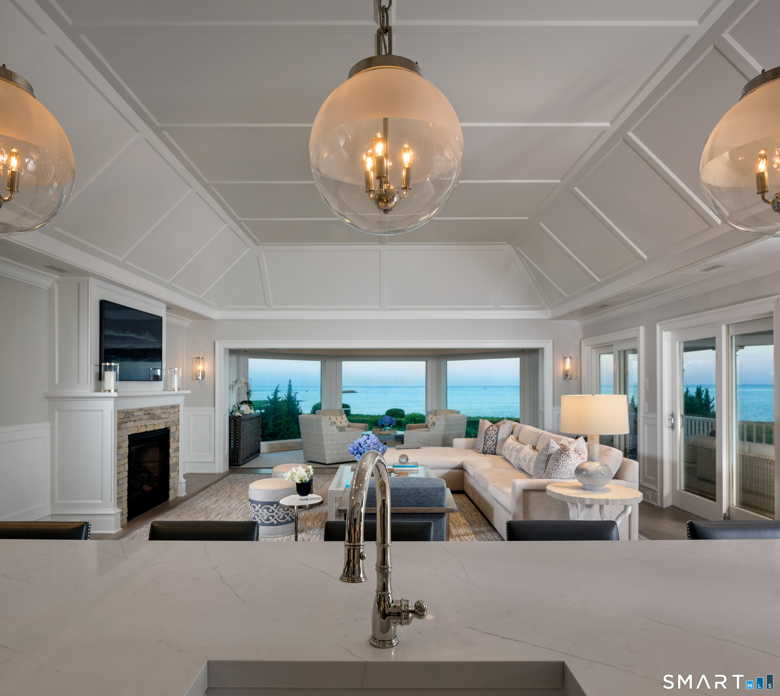 7 Sandpiper Road Westport, CT 06880 - Photo 8 of 34 a living room with furniture a fireplace and a flat screen tv