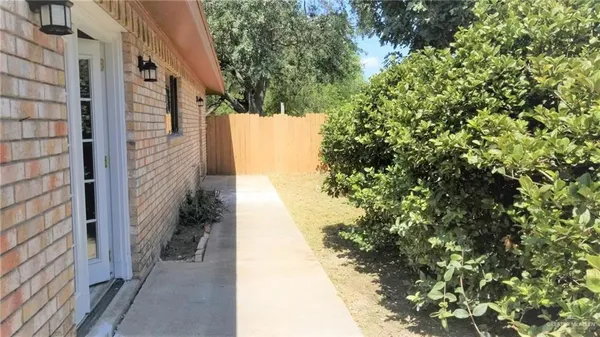 a view of a pathway both side of house